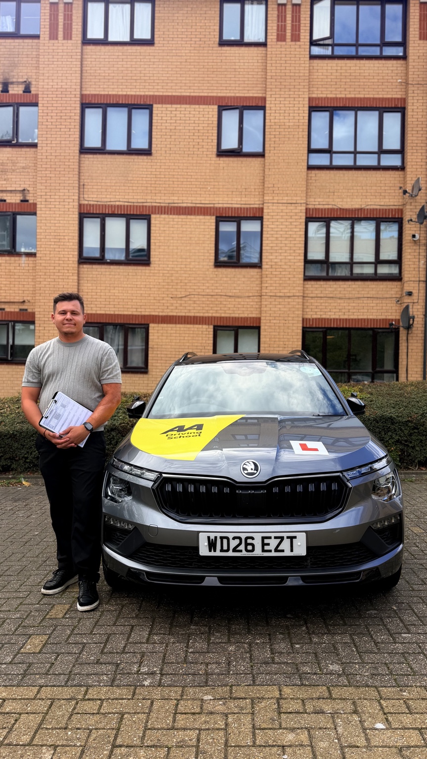 Cristian from CN Driver Training beside his automatic Skoda tuition car