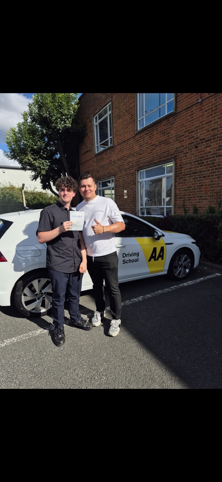 Learner and instructor celebrating a practical test pass