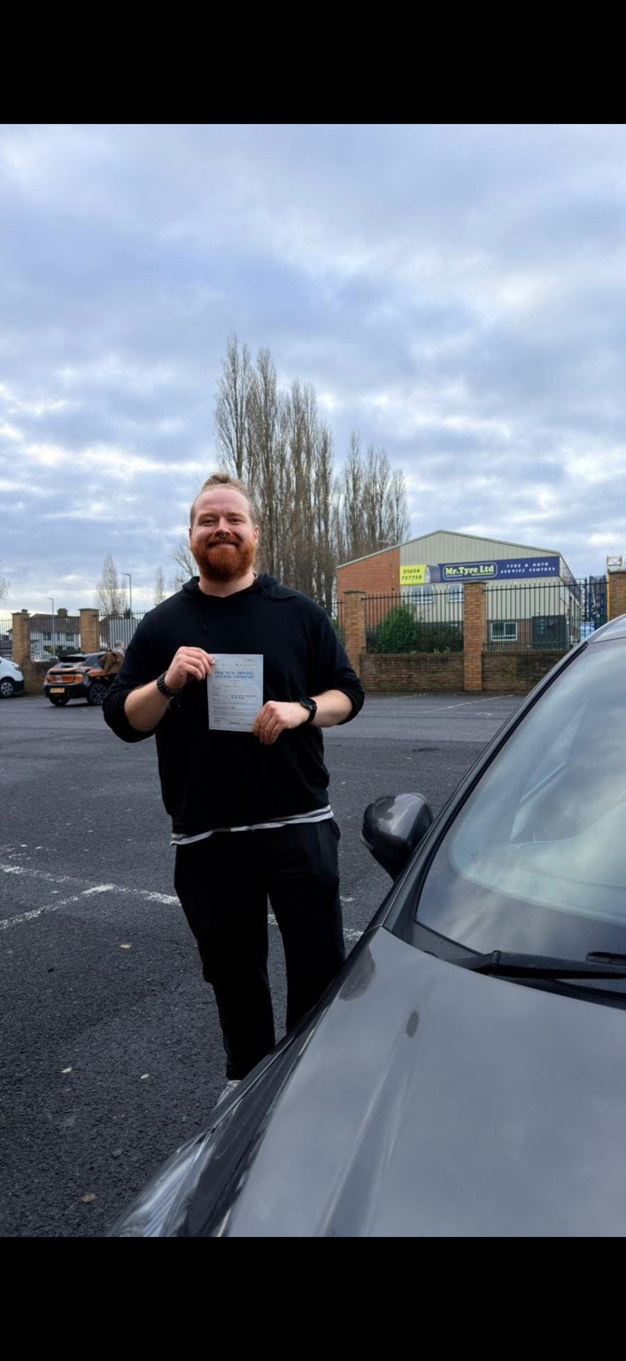 Learner celebrating a practical driving test pass